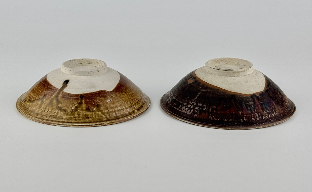 Pair of 15th-century Vietnamese Annamese stoneware bowls with carved floral decoration and olive-green to iron-brown glaze.