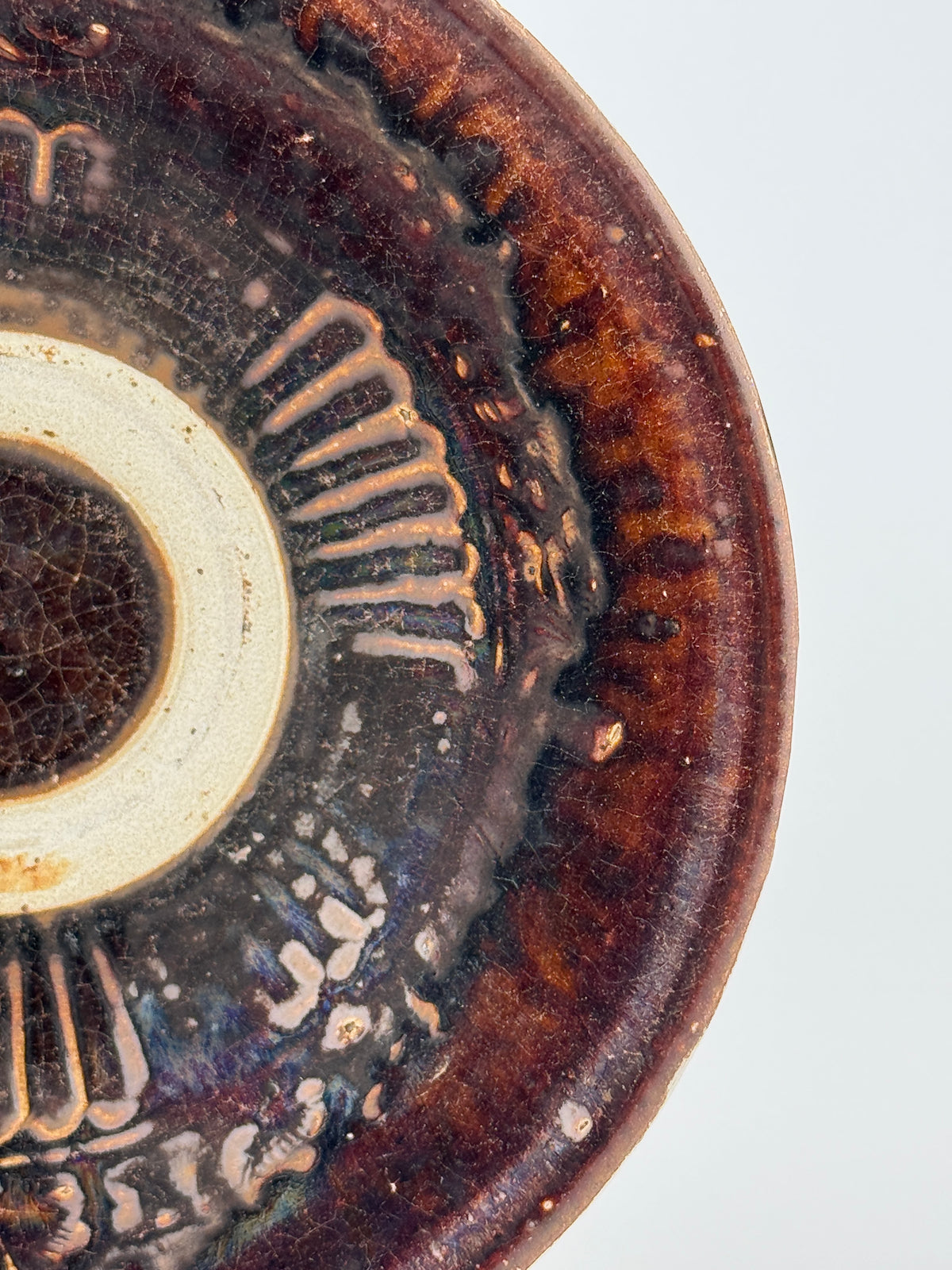 Pair of 15th-century Vietnamese Annamese stoneware bowls with carved floral decoration and olive-green to iron-brown glaze.