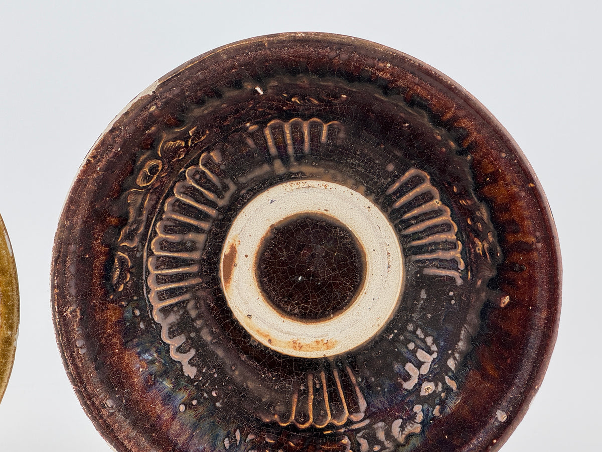 Pair of 15th-century Vietnamese Annamese stoneware bowls with carved floral decoration and olive-green to iron-brown glaze.