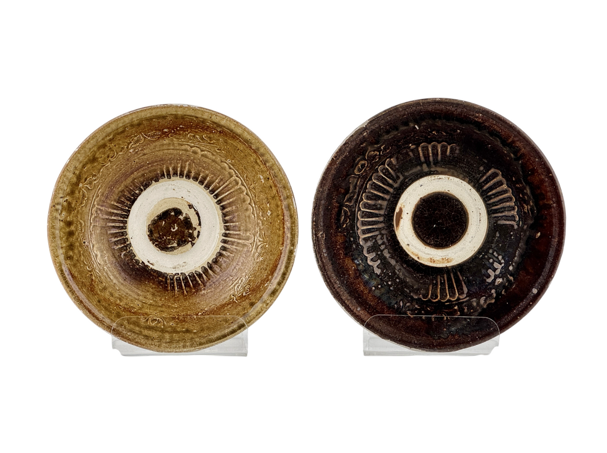 Pair of 15th-century Vietnamese Annamese stoneware bowls with carved floral decoration and olive-green to iron-brown glaze.