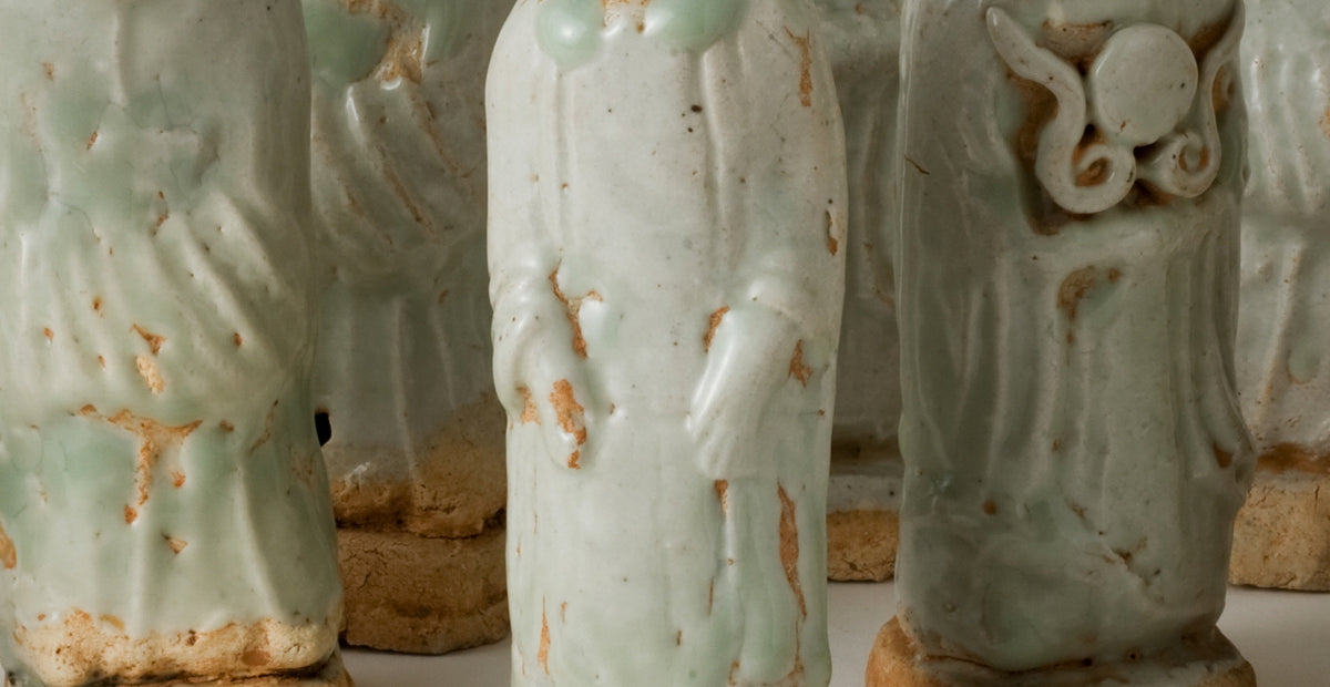 Ten Qingbai porcelain courtier figurines, Five Dynasties to Song Dynasty, with official robes and square pedestals.