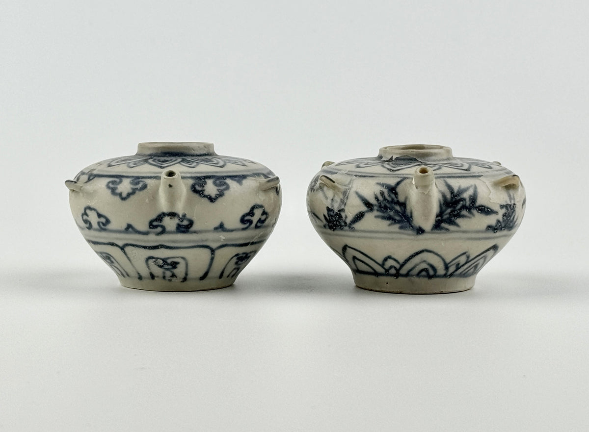 Vietnamese Chu Dau kilns blue-and-white water vessels with lotus, cloud-scroll, and orchid motifs, Le Dynasty.