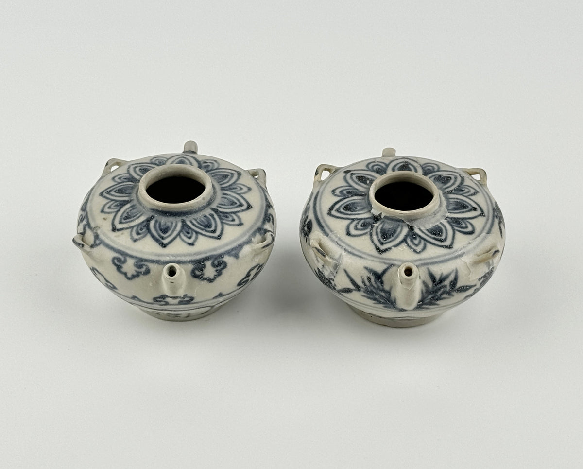 Vietnamese Chu Dau kilns blue-and-white water vessels with lotus, cloud-scroll, and orchid motifs, Le Dynasty.