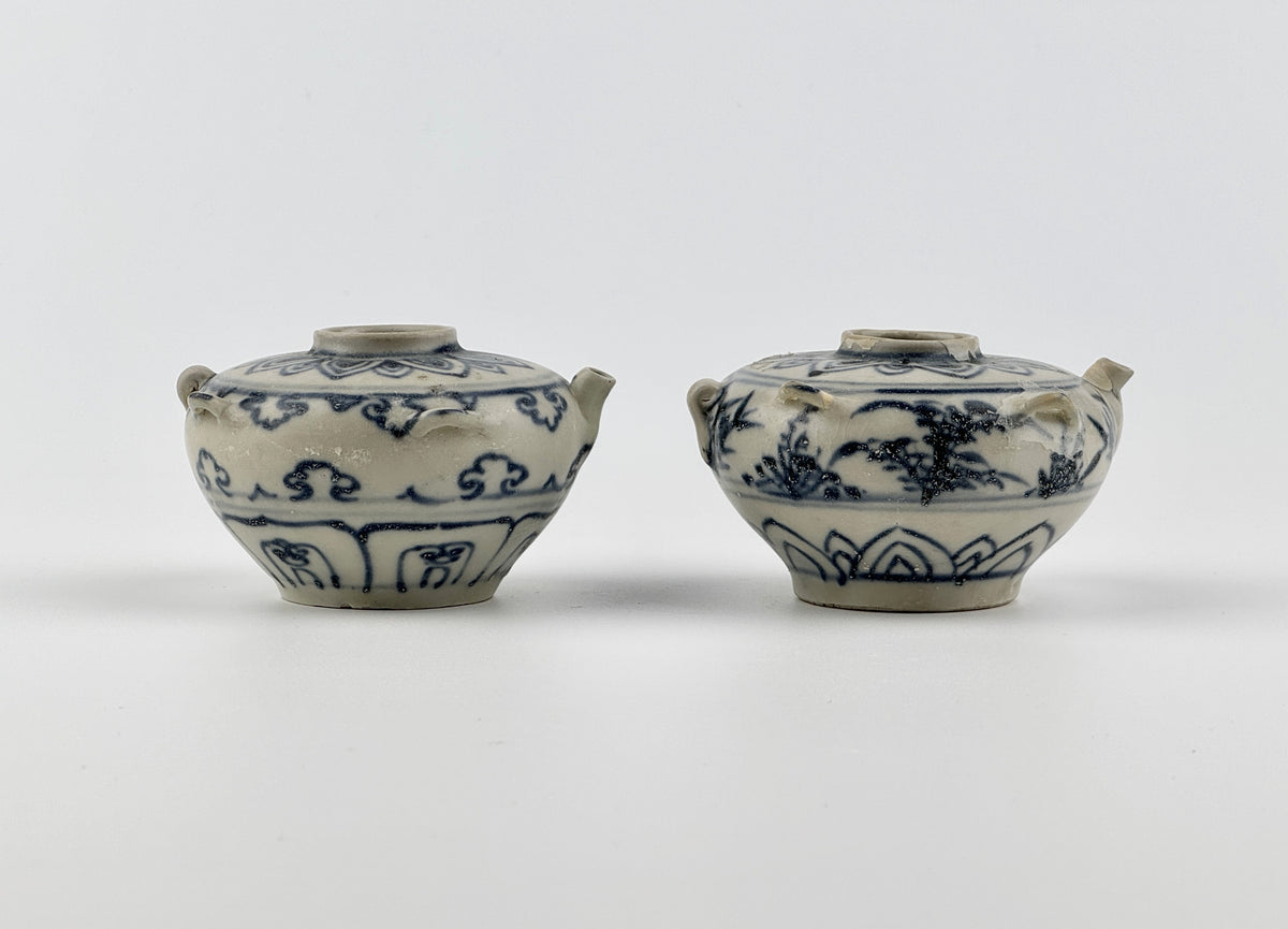 Vietnamese Chu Dau kilns blue-and-white water vessels with lotus, cloud-scroll, and orchid motifs, Le Dynasty.