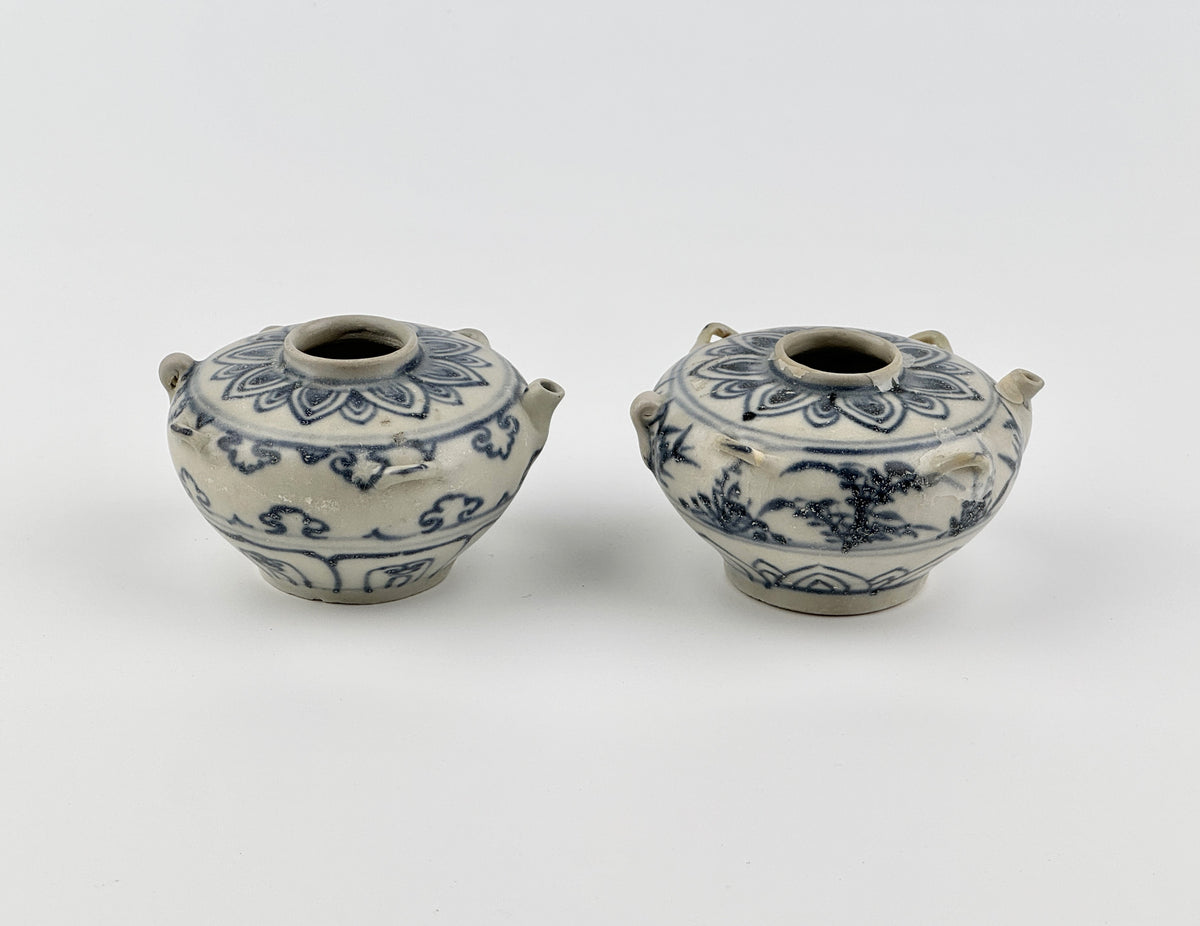 Vietnamese Chu Dau kilns blue-and-white water vessels with lotus, cloud-scroll, and orchid motifs, Le Dynasty.