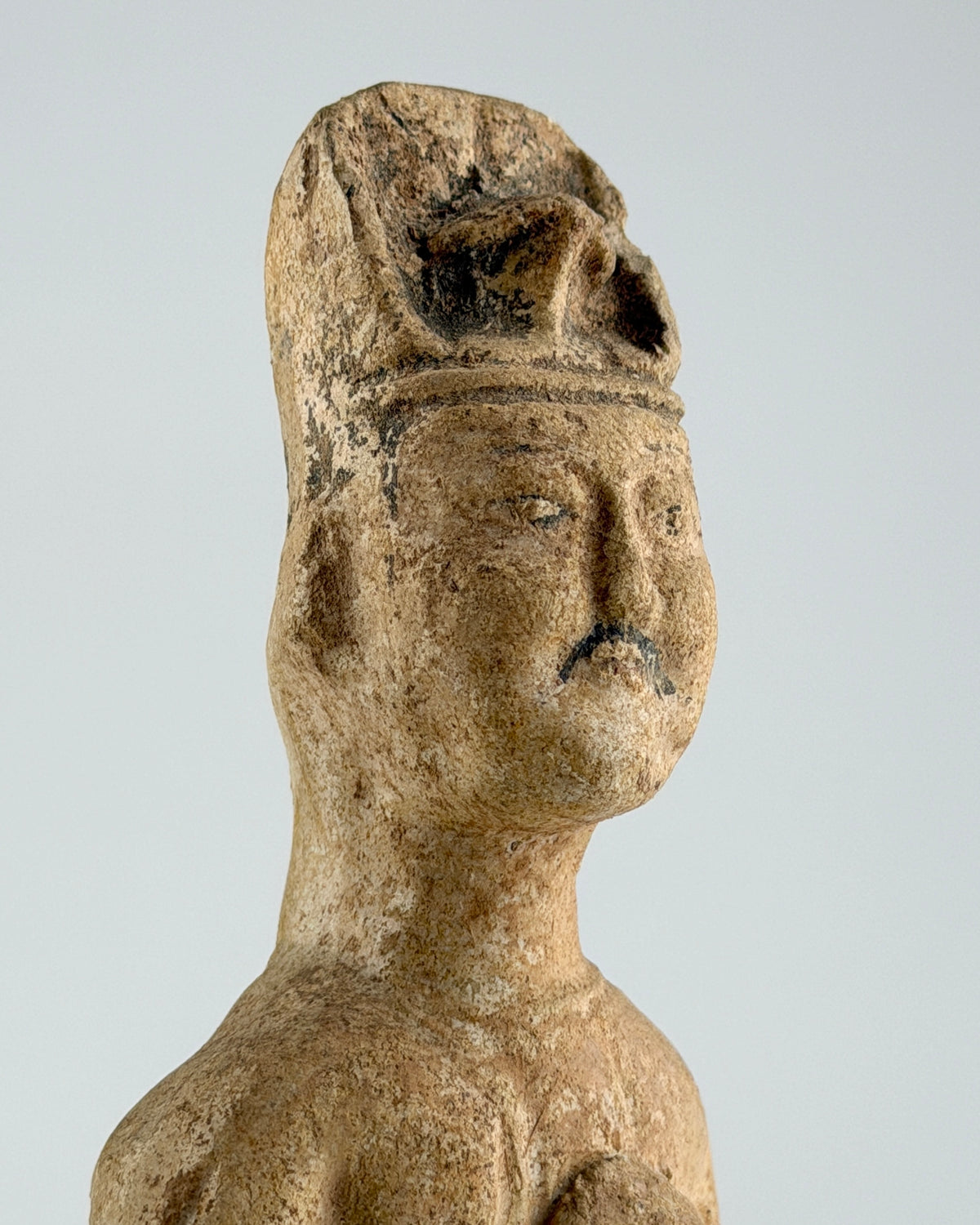 Sui-Tang Dynasty pair of straw-glazed pottery court figures with traditional robes, official cap, and red pigment traces.